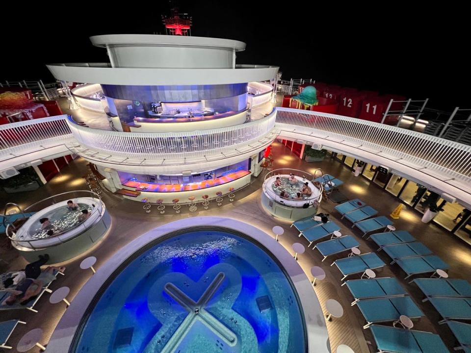 Overview of the well-being pool and hot tubs on the Virgin Voyages Valiant Lady