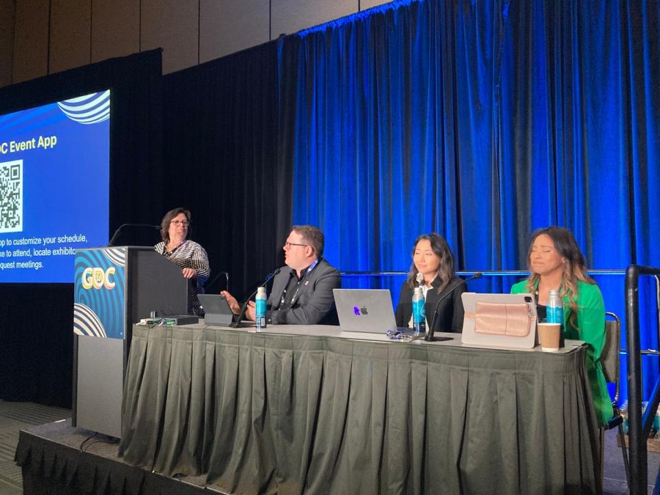 SAG-AFTRA national executive director Duncan Crabtree-Ireland, second from left, speaks on a panel at GDC (Io Dodds / The Independent)