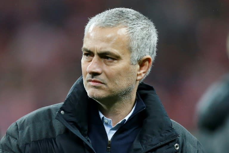 Manchester United's manager Jose Mourinho watches the celebrations on the pitch after their victory in the English League Cup final football match against Southampton February 26, 2017