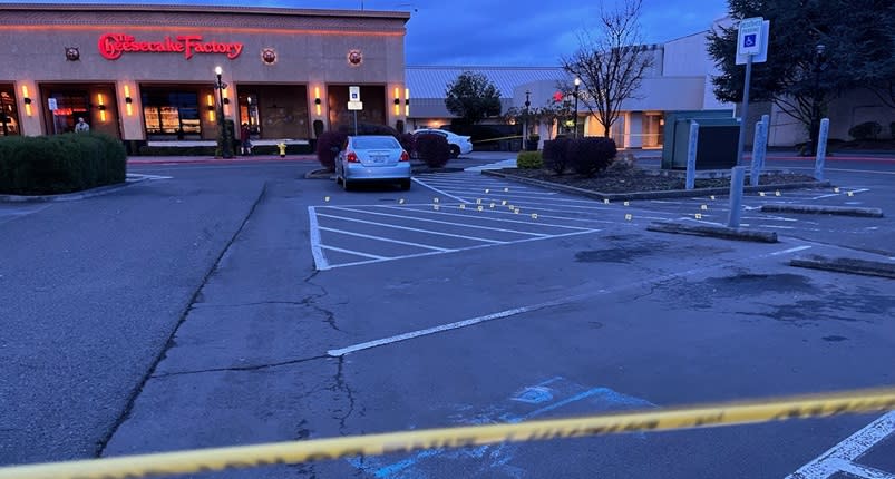 Evidence markers note shell casings in the parking lot of the Clackamas Town Center outside the Cheesecake Factory, April 7, 2024 (KOIN)