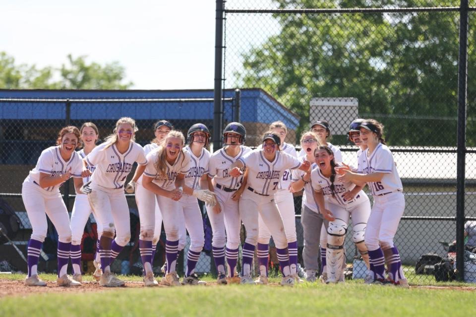 Happy Monroe-Woodbury team awaits a runner to come home in Sunday's Section 9 Class AA final against Warwick.