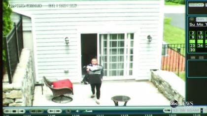 Surveillance video shows Shayanna Jenkins leaving the house with a trash bag the day after Odin Lloyd's murder.