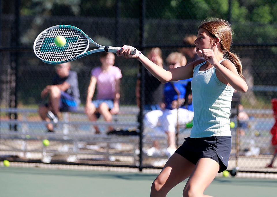 Isabella McArdle returns a volley during her match in the Brookside junior tennis program championships on Thursday, June 30, 2022. TOM E. PUSKAR/ASHLAND TIMES-GAZETTE