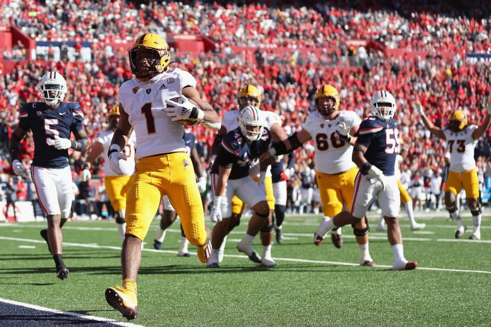 Running back Xazavian Valladay #1 of the Arizona State Sun Devils scores a four-yard rushing touchdown against the Arizona Wildcats during the first half of the NCAAF game at Arizona Stadium on Nov. 25, 2022, in Tucson, Arizona.