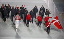 Denmark's flag-bearer Lene Nielsen leads her country's contingent during the opening ceremony of the 2014 Sochi Winter Olympics, February 7, 2014. REUTERS/Lucy Nicholson (RUSSIA - Tags: OLYMPICS SPORT)