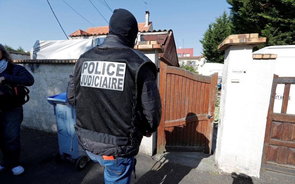 French police arrive at the house of the gunman killed in a shootout with police on the Champs Elysees Avenue, in the Paris suburb of Chelles - Credit: REUTERS/Charles Platiau