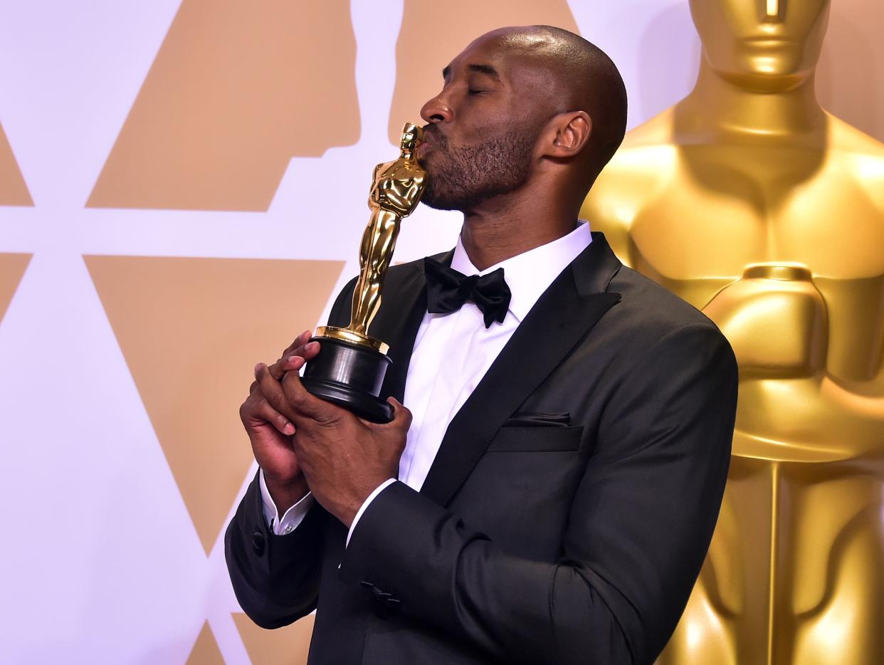 TOPSHOT - Kobe Bryant poses in the press room with the Oscar for Best Animated Short Film for "Dear Basketball," during the 90th Annual Academy Awards on March 4, 2018, in Hollywood, California. (Photo by FREDERIC J. BROWN / AFP)        (Photo credit should read FREDERIC J. BROWN/AFP via Getty Images)