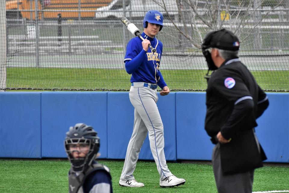 Francis Howell's Brett Norfleet (center) waits on deck during the Vikings' 11-0 win over Battle on April 15, 2022, at Battle High School. Norfleet is committed to the University of Missouri to play football for Eliah Drinkwitz and baseball for Steve Bieser.