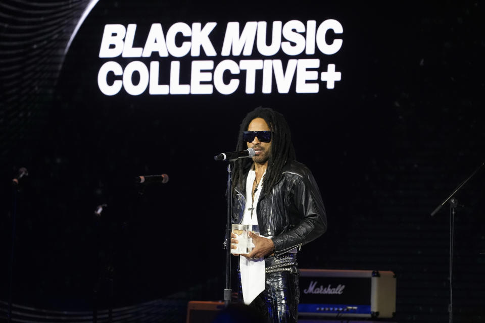 Four-time Grammy-winning artist Lenny Kravitz receives the Recording Academy Global Impact Award at the third annual Recording Academy Honors Presented by The Black Music Collective in Los Angeles on Thursday, Feb. 1, 2024. (AP Photo/Damian Dovarganes)