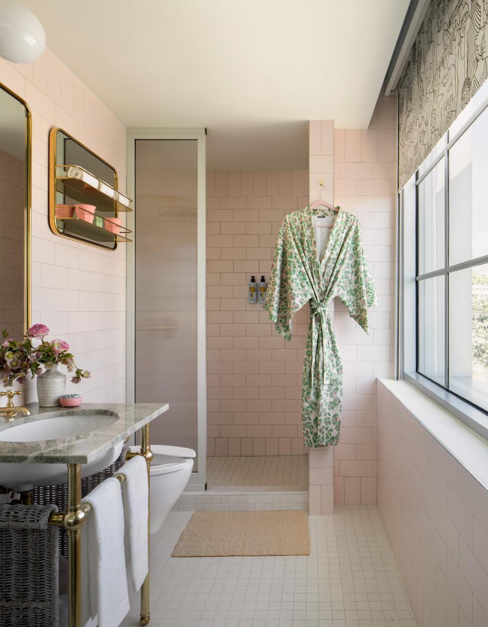 Guest rooms at the hotel feature Ortigia bath products and pink leopard-print robes.