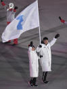 <p>North Korea’s Hwang Chung Gum and South Korea’s Won Yun-jong arrive during the opening ceremony of the 2018 Winter Olympics in Pyeongchang, South Korea, Friday, Feb. 9, 2018. (Franck Fife/Pool Photo via AP) </p>