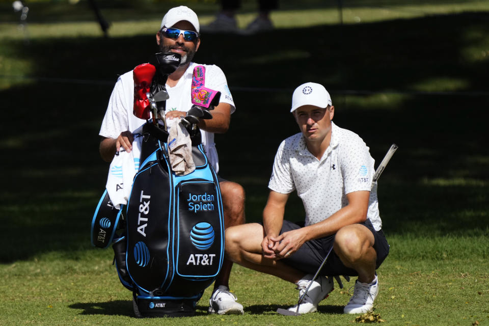 Jordan Spieth, right, waits to hit from the eighth fairway during the pro-am event at the Sony Open golf tournament, Wednesday, Jan. 11, 2023, at Waialae Country Club in Honolulu. (AP Photo/Matt York)