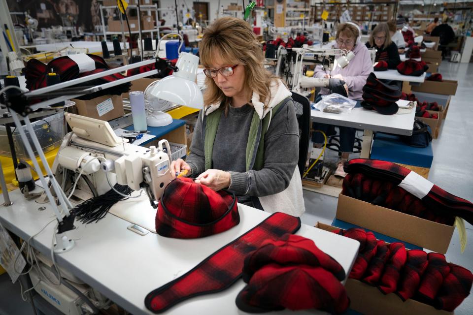 Wendy Ouellette, 54, of Montreal, Wis., sews the ear flaps on Stormy Kromer hats in the Jacquart Fabric Products, home of Stormy Kromer, manufacturing facility in Ironwood on Thursday, Jan. 4, 2024.