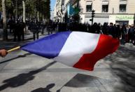 Protesters attend a demonstration on Act 45 (the 45th consecutive national protest on Saturday) of the yellow vests movement in Paris