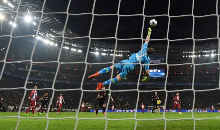 Atletico Madrid's midfielder Saul Niguez scores past Leverkusen's goalkeeper Bernd Leno during the Champions League football match February 21, 2017