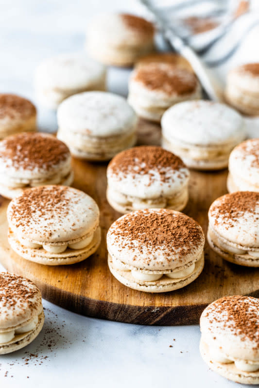 <p>Pies and Tacos</p><p>The Tiramisu macaron shells have a light espresso flavor, then they are filled with a sweet mascarpone filling, and are dusted cocoa powder on top.</p><p><strong>Get the recipe: <a href="https://www.piesandtacos.com/tiramisu-macarons/" rel="nofollow noopener" target="_blank" data-ylk="slk:Tiramisu Macarons;elm:context_link;itc:0;sec:content-canvas" class="link "><em>Tiramisu Macarons</em></a></strong></p>