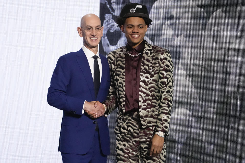 Keyonte George poses for a photo with NBA Commissioner Adam Silver after being selected 16th overall by the Utah Jazz during the NBA basketball draft, Thursday, June 22, 2023, in New York. (AP Photo/John Minchillo)