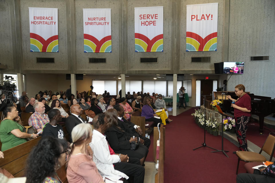 Julianne Malveaux, an economist, author, and dean of the College of Ethnic Studies at California State University, Los Angeles, right, addresses, survivors and descendants of Section 14 gathered at the United Methodist Church in Palm Springs, Calif., Sunday, April 16, 2023. Black and Latino Californians who were displaced from their Section 14 neighborhood in Palm Springs allege the city pushed them out by hiring contractors to destroy homes in an area that was tight-knit and full of diversity. (AP Photo/Damian Dovarganes)