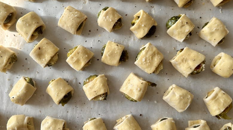 seasoned pastry-wrapped sprouts on pan