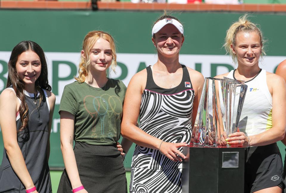 From left, Stephanie De La Rosa and Caitlyn Hill pose for a photo with the womenÕs doubles champions Katerina Siniakova, right, and Barbora Krejcikova during the BNP Paribas Open in Indian Wells, Calif., Mar. 19, 2023. 