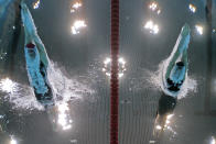 LONDON, ENGLAND - JULY 31: (L-R) Gemma Lowe of Great Britain and Kathleen Hersey of the United States dive in the water at the start of the Women's 200m Butterfly semi final 2 on Day 4 of the London 2012 Olympic Games at the Aquatics Centre on July 31, 2012 in London, England. (Photo by Adam Pretty/Getty Images)