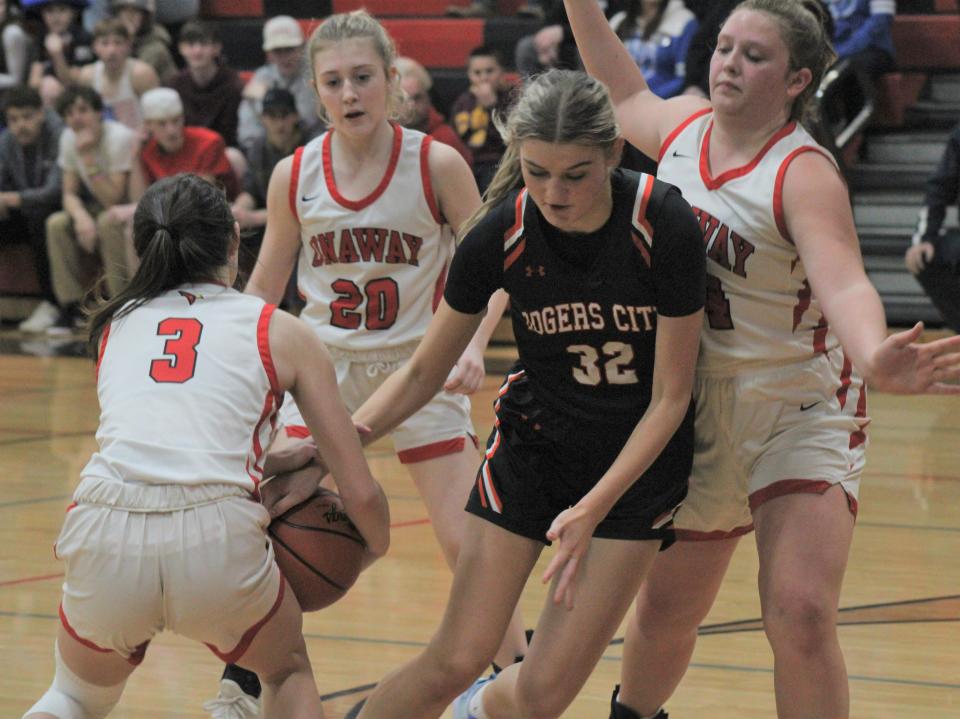 Onaway's Charlotte Box (3), Ema DeMaestri (right) and Natalie Hyde (20) surround Rogers City's Alivia Freel (32) during the second half on Wednesday.