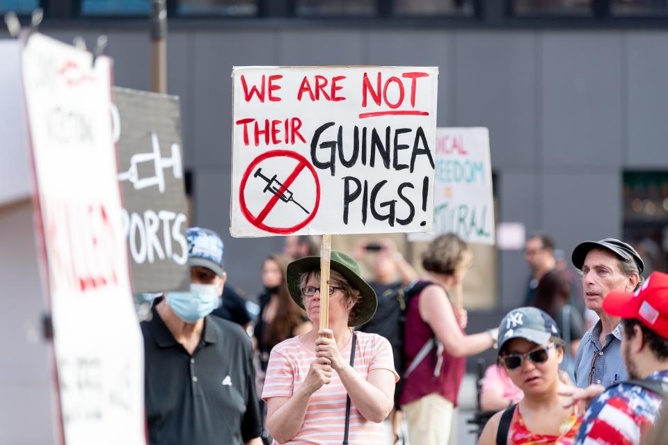 Anti- vaccination activists protest the proof of vaccination requirement to get into the Foo Fighters' show. Madison Square Garden reopened with the first full capacity concert since March 2020 on June 20, 2021, in New York.