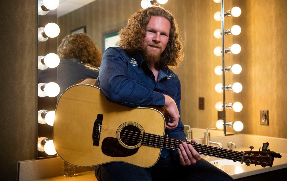 Singer and guitarist Josh Martin of the Wood Box Heroes waits backstage at the Grand Ole Opry on  Aug. 5.