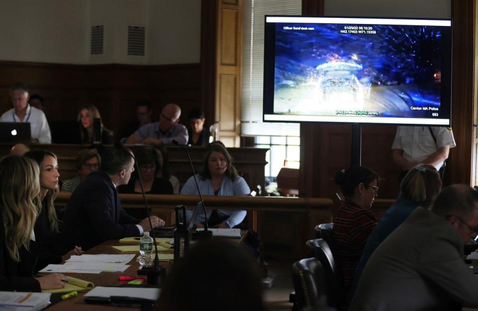 Read, second from left, with her defense team, looks a a video from the dash cam of Canton Police Officer Steven Saraf during the trial (AP)