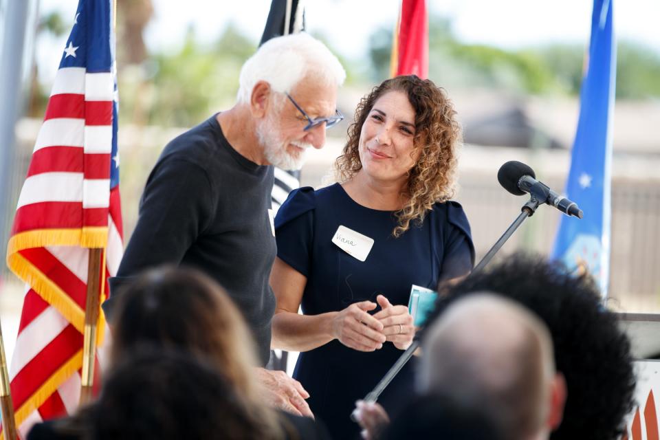 Viana Hernandez stands with her dad, Vincent White, an Army Veteran, as they share their story during the grand opening of the new Veterans Village of Cathedral City in Cathedral City, Calif., on Thursday, Nov. 10, 2022. 