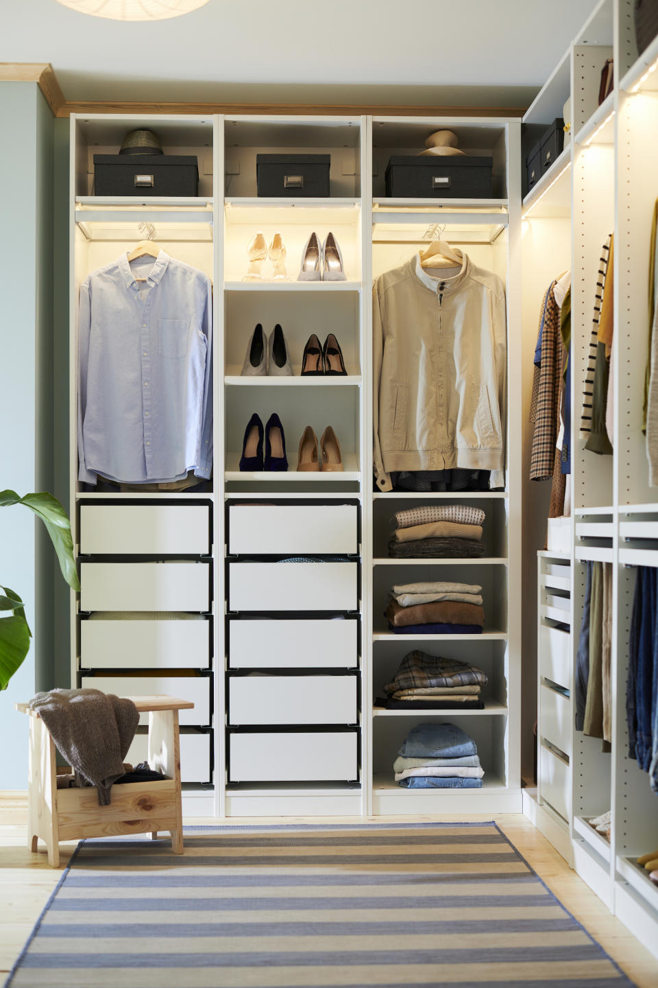 <p> One consideration when designing your own walk-in closet is to choose what combinations of storage will work best. Do you prefer to have more hanging items or do you like to keep things neatly folded in drawers or on shelves? This Ikea Pax combination shows you how to use both successfully within this corner closet.&#xA0; </p>