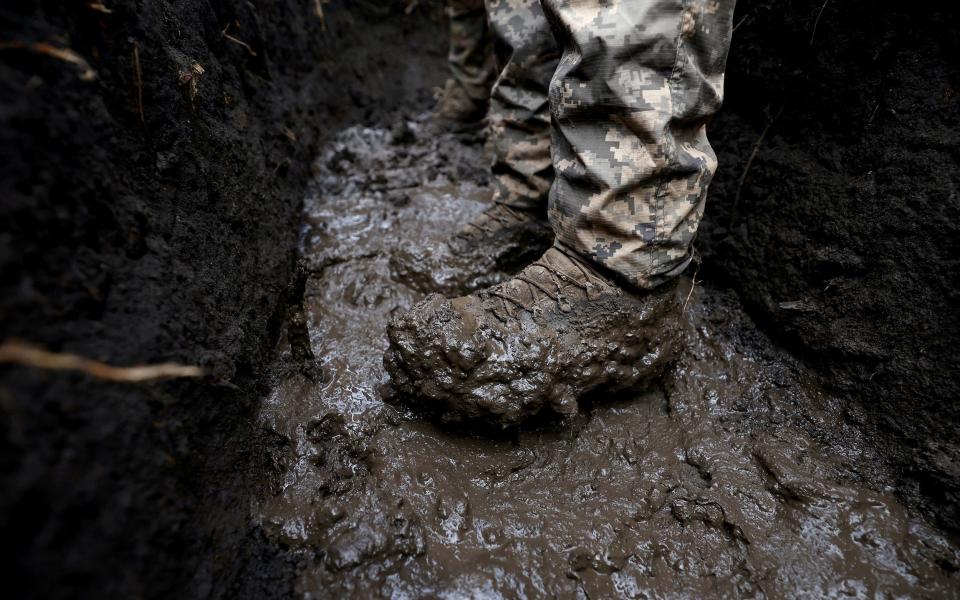 Trenches in the Donetsk region continue to thaw and become full of mud - LISI NIESNER/REUTERS