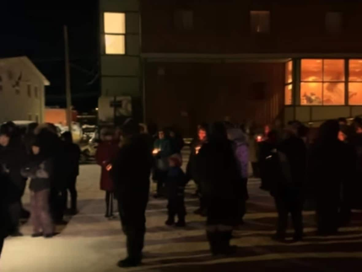 Community members held a vigil in Kugluktuk, Nunavut, after a six-month sentence for manslaughter was delivered in the brutal death of Margaret Ogina.  (Falisha Klengenberg/Facebook - image credit)