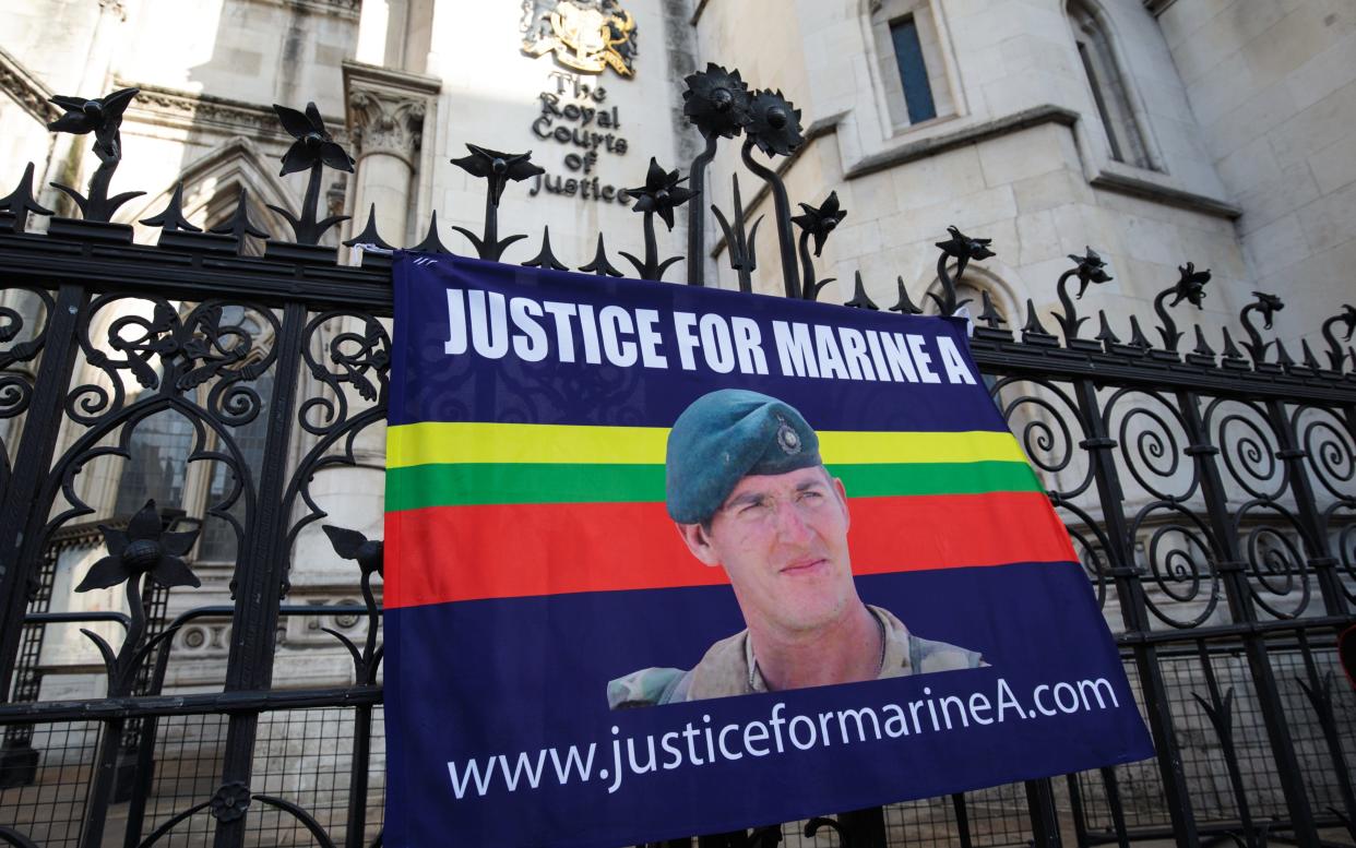 A banner in support of British Sergeant Alexander Blackman hangs from a fence outside the Royal Courts of Justice - 2017 Getty Images