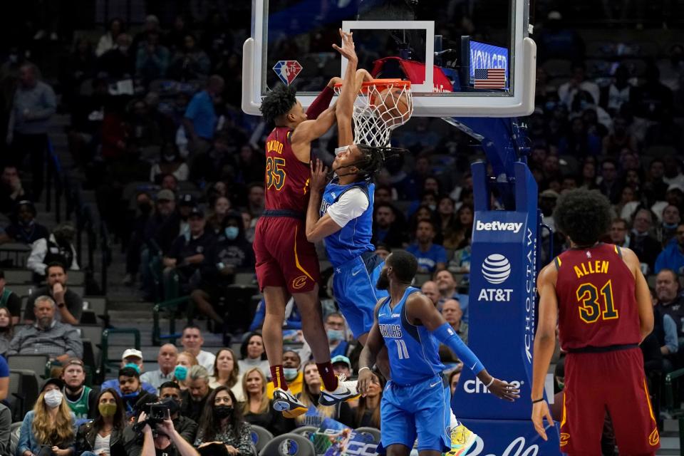 Cavaliers guard Isaac Okoro (35) dunks over Dallas Mavericks center Moses Brown (9) during the Cavs' 114-96 win Monday night in Dallas.. [Tony Gutierrez/Associated Press]