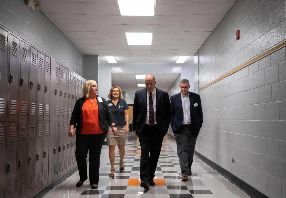 Cabarrus County Schools Superintendent Dr. John Kopicki, center, tours Northwest Cabarrus STEM Middle School, talking to students and staff on the first day of school on Thursday, August 10, 2023.