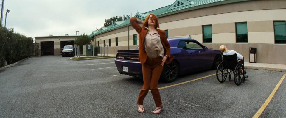 a person walking in a parking lot