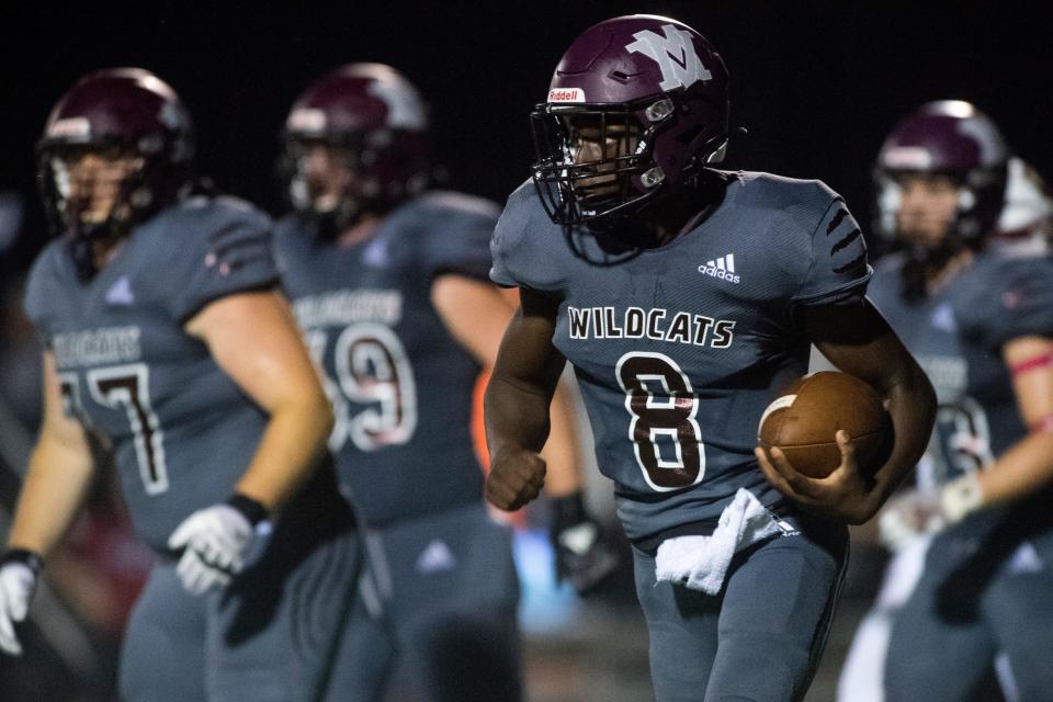 Mt. Vernon’s Nicot Burnett (8) carries the ball as the Gibson Southern Titans play the Mt. Vernon Wildcats in Mt. Vernon, Ind., Friday evening, Oct. 1, 2021. 