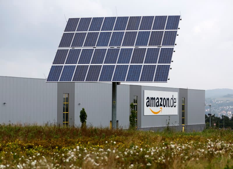 FILE PHOTO: Solar panels stand in front of the Amazon distribution centre in Bad Hersfeld