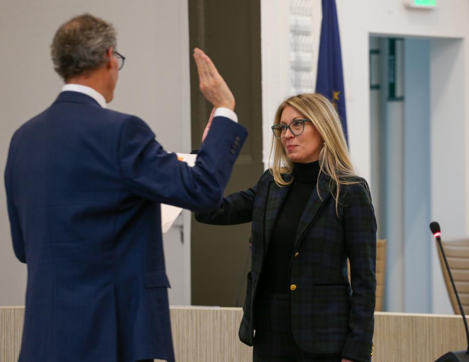John Dennis, the former mayor of the City of West Lafayette swears in Erin Easter, the new mayor of the City of West Lafayette, at the swearing in ceremony for the 2023 West Lafayette election winners, on Thursday, Dec. 28, 2023, in West Lafayette, Ind.