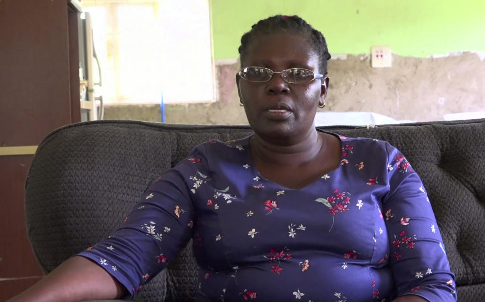 In this image taken from video, Margaret Ntale, whose three student daughters are stranded in Wuhan, speaks to The Associated Press at her house in Kampala, Uganda on Thursday, Feb. 27, 2020. Parents' fears are growing for the thousands of African students who are thought to be stranded in China's locked-down city of Wuhan amid the virus outbreak, with concerns that students are running out of food and money weeks after other countries evacuated citizens. (AP Photo)