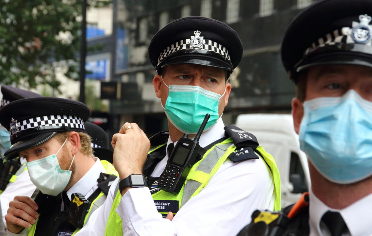  Police officers wear face masks as they patrol a protest ground in London. A change in policy has meant that in some situations where social distancing is impossible, Police at demonstrations will wear Protective face masks. A spokesperson said: "If officers cannot maintain a two metre gap and where there is a possible risk of infection, our policy is now that officers will wear a facemask, which all officers have readily available." (Photo by Keith Mayhew / SOPA Images/Sipa USA) 