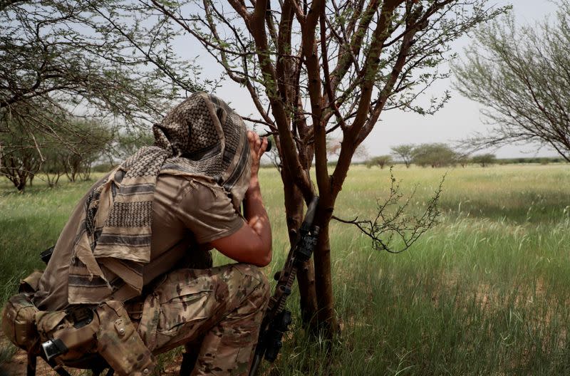 FILE PHOTO: A soldier from the new Takuba force keeps watch during a patrol with Malian soldiers near Niger border in Dansongo Circle