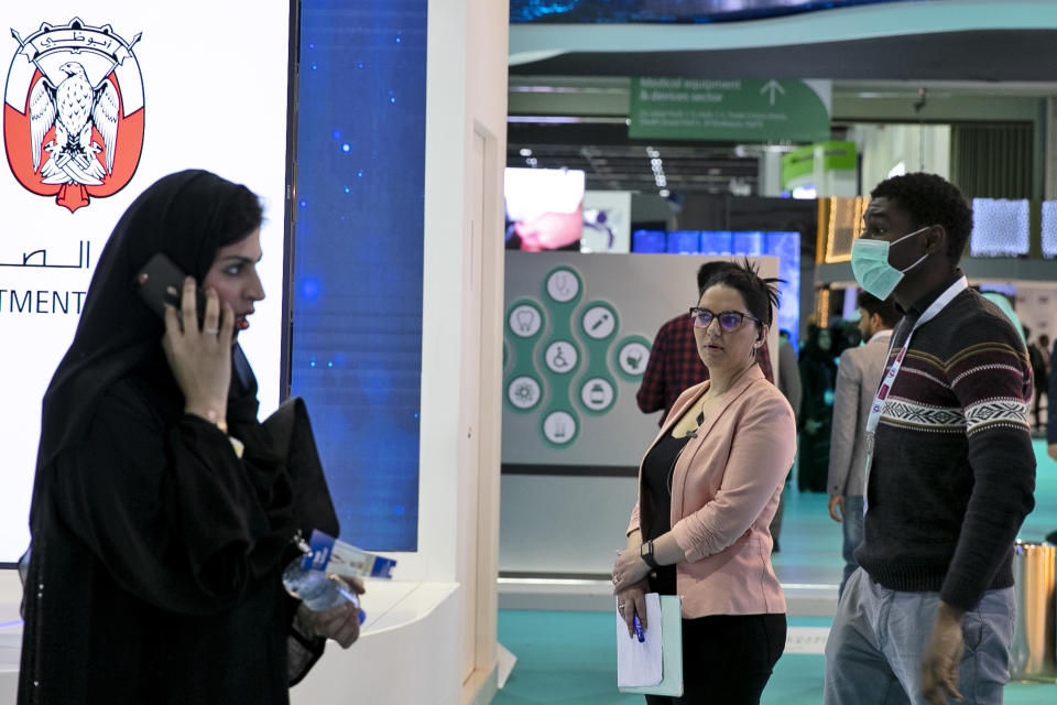 A man wears a mask as he visits the UAE ministry stand during the Arab Health Exhibition in Dubai, United Arab Emirates, Wednesday, Jan. 29, 2020. The United Arab Emirates on Wednesday confirmed the first cases in the Mideast of the new Chinese virus that causes flu-like symptoms, saying doctors now were treating a family that had just come from a city at the epicenter of the outbreak. (AP Photo/Kamran Jebreili)