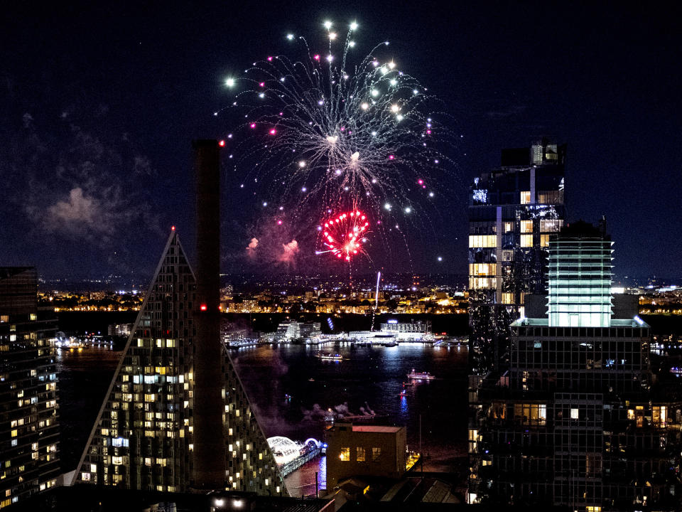 Fireworks, one in the shape of a heart, light up the sky over the Hudson River and the Pride Island concert venue, lower center left, part of the Stonewall 50 and World Pride festivities, Sunday, June 30, 2019. (AP Photo/Craig Ruttle)