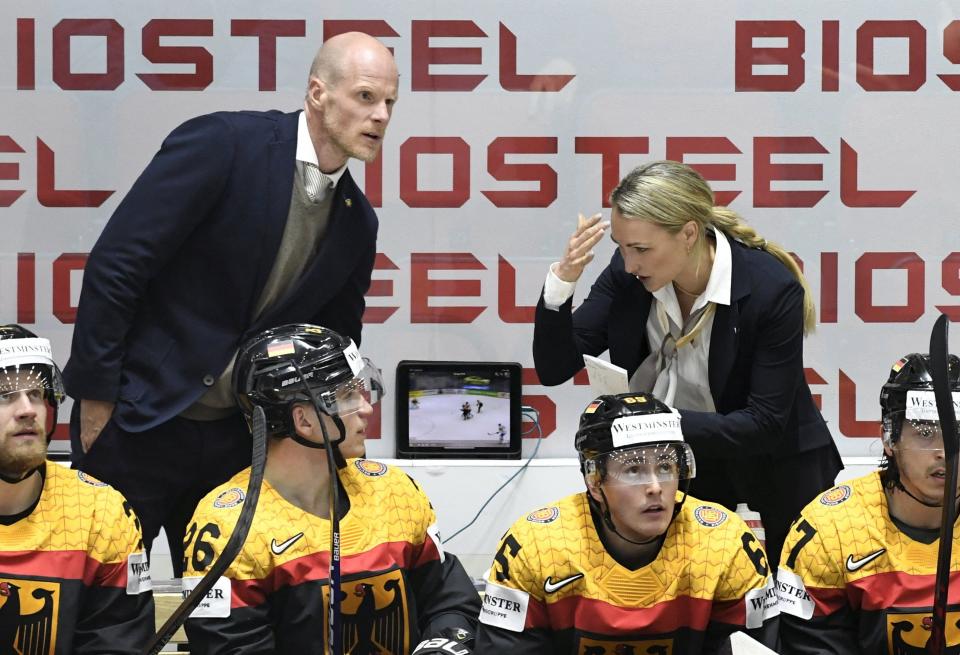 Assistant coach Jessica Campbell speaks with a German player during the 2022 IIHF World Championships on May 20, 2022. On July 5, Campbell was hired as an assistant coach with the Coachella Valley Firebirds.