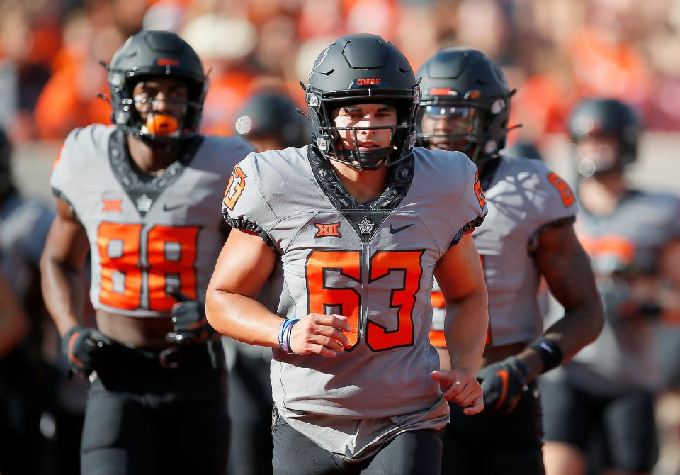 Sep 17, 2022; Stillwater, Oklahoma, USA; Oklahoma State's Zeke Zaragoza (63) warms up during a college football game between the Oklahoma State University Cowboys (OSU) and the University of Arkansas at Pine Bluff Golden Lions at Boone Pickens Stadium. Mandatory Credit: Sarah Phipps-USA TODAY Sports