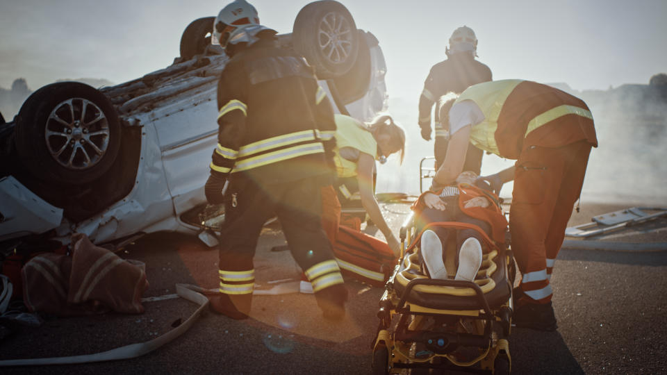 Paramedics rescuing car accident victim. Source: Getty Images