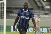 Inter Milan's Romelu Lukaku celebrates after scoring his side's fifth goal during the Europa League semifinal soccer match between Inter Milan and Shakhtar Donetsk at Dusseldorf Arena, in Duesseldorf, Germany, Monday, Aug. 17, 2020. (Lars Baron/Pool Photo via AP)