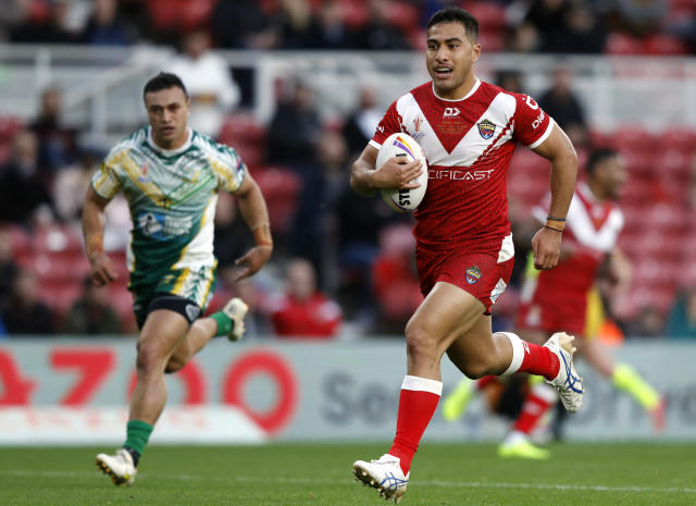 Tonga's Will Penisini scores a try during the Rugby League World